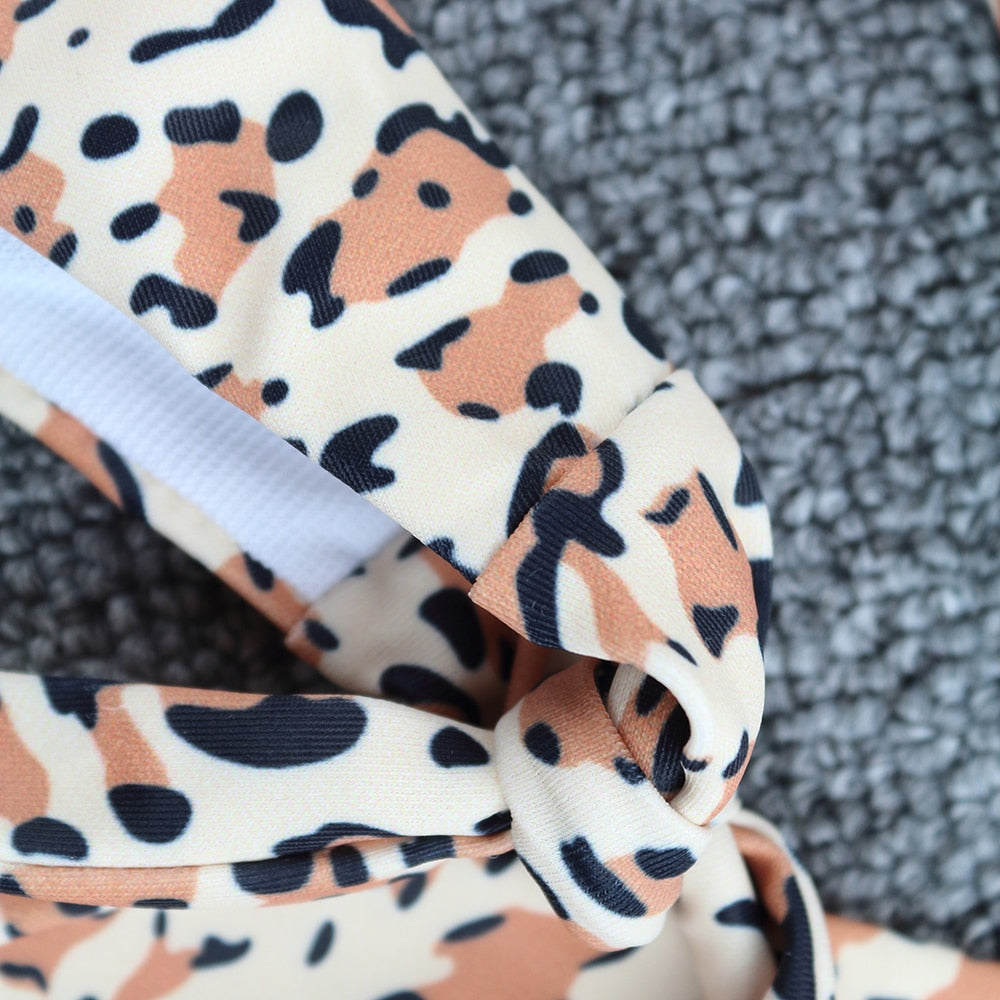 Bikini Aumare Bianca Jagger print felino coral — espalda
